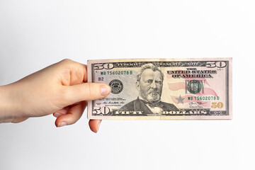 Fifty dollars banknote in hand, cash money to spend right now. Economic crisis as a consequences of quarantine.