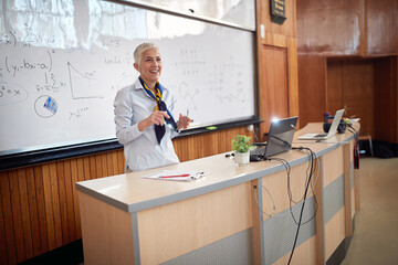 Female elderly professor giving a lecture