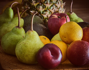 Naklejka na ściany i meble A bowl of fruit on a wooden table