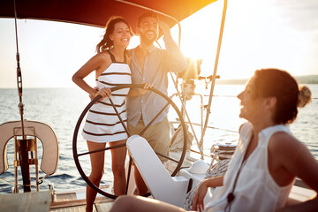 couple enjoying on luxury boat at sunset on romantic vacation