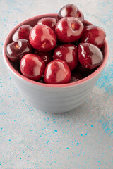 closeup fresh ripe cherry fruits in a bowl on table