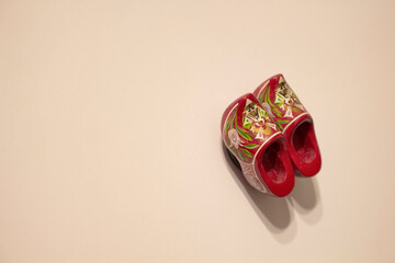 Close up view of isolated wood magnet (souvenir) shaped of Dutch slippers