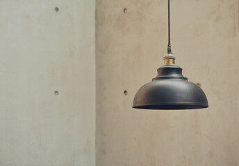 Black minimalist lamp cap, with white cement wall as background in minimalist concept. Industrial concept stock photos. Minimalist interior. industrial home applicant.