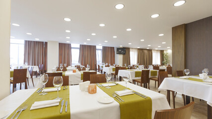 Large dining room at hotel. Modern interior