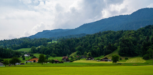 Idyllic rural view of farmland in the beautiful surroundings near Basel, Switzerland, Europe, close to the France and German borders. Fields and wonderful blue sky, panoramic view with shadows.