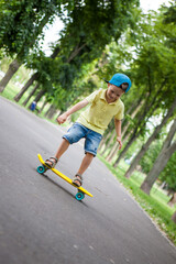 Little boy on skate board.
