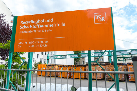 Berlin, Germany - June 8, 2020: Orange signage of the BSR Berliner Stadtreinigungsbetriebe Recyclinghof und Schadstoffsammelstelle, German for recycling yard and pollutant collection point
