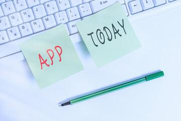 Writing note showing App. Business concept for computer or software application designed to run on...