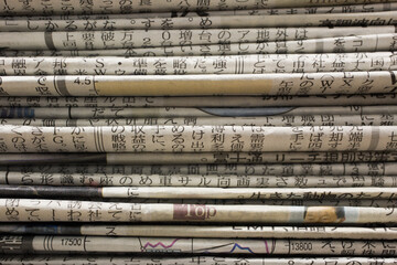 Close up of stack of Japanese newspapers