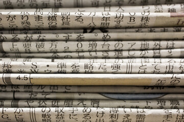 Close up of stack of Japanese newspapers
