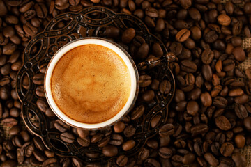 Turkish coffee. Copper cup with traditional oriental patterns of demitasse, oriental sweets rahat lokum