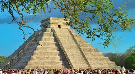 CHICHEN ITZA, MEXICO - MARCH 21,2014: Tourists watching the feathered serpent crawling down the temple (Equinox March 21 2014)