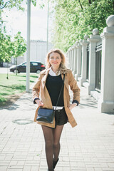 Obraz premium stylish blonde girl walks the streets