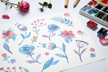 Composition with floral picture and watercolor paints on white background