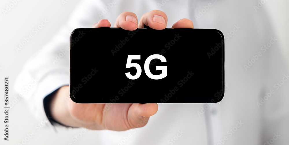 Poster smart phone with 5g network standard communication. black phone screen with 5g text inscription in m