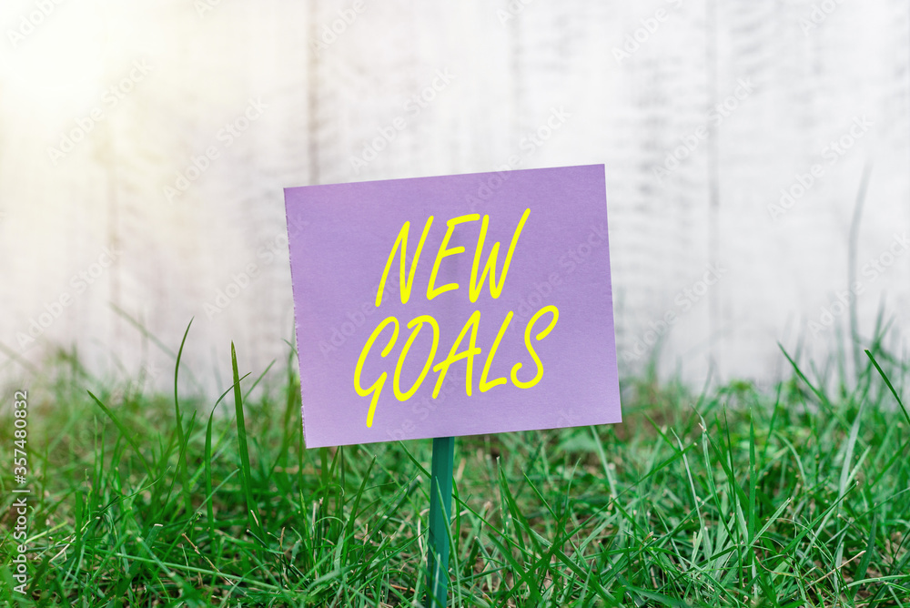 Poster writing note showing new goals. business concept for a list of clearlydefined plans that an individu