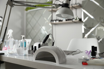 Professional equipment for manicure on table in beauty salon