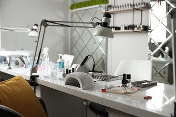 Professional equipment for manicure on table in beauty salon