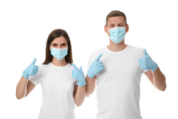 Volunteers in masks and gloves on white background. Protective measures during coronavirus...