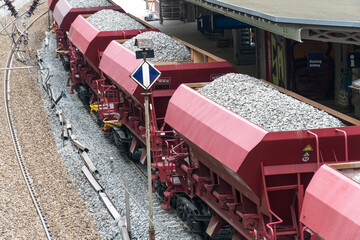 Cargo train with aggregate stones, view from above
