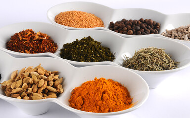 spices in white plates close-up