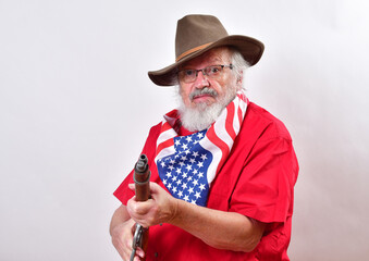 Angry old man, armed with a sawed off rifle, wearing patriotic colors, eyeglasses and a floppy western hat..Go ahead, make my day - obrazy, fototapety, plakaty