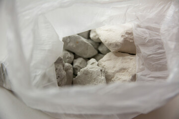 Slices of edible chalk and clay in a plastic bag, sorbents