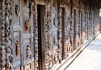 Wall with sculptures in Shwenandaw Kyaung Temple in Mandalay
