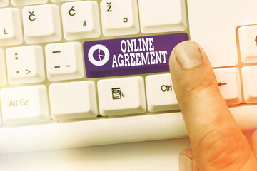 Handwriting text Online Agreement. Conceptual photo contracts that are created and signed over the...