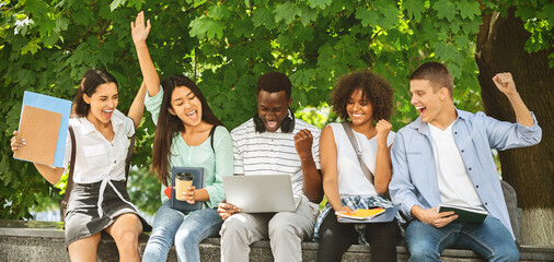 Accepted Students. Joyful Multicultural Teens Celebrating Success With Laptop Outdoors