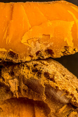 Two large pieces of cheese Mimolette. Healthy food background. Healthy fresh nutrition.