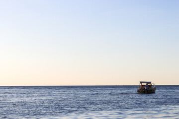 fishing boat at sunset
