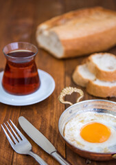 Turkish tea, fried egg and bread.