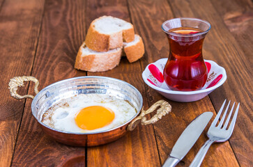 Turkish tea, fried egg and bread.