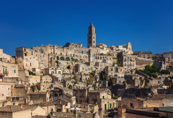 Fototapeta na wymiar Panorama of famous Italian city Matera. Matera city in the region of Basilicata, in Southern Italy, is a complex of cave dwellings carved into the ancient river canyon.