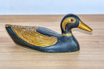 wooden duck on a wooden background