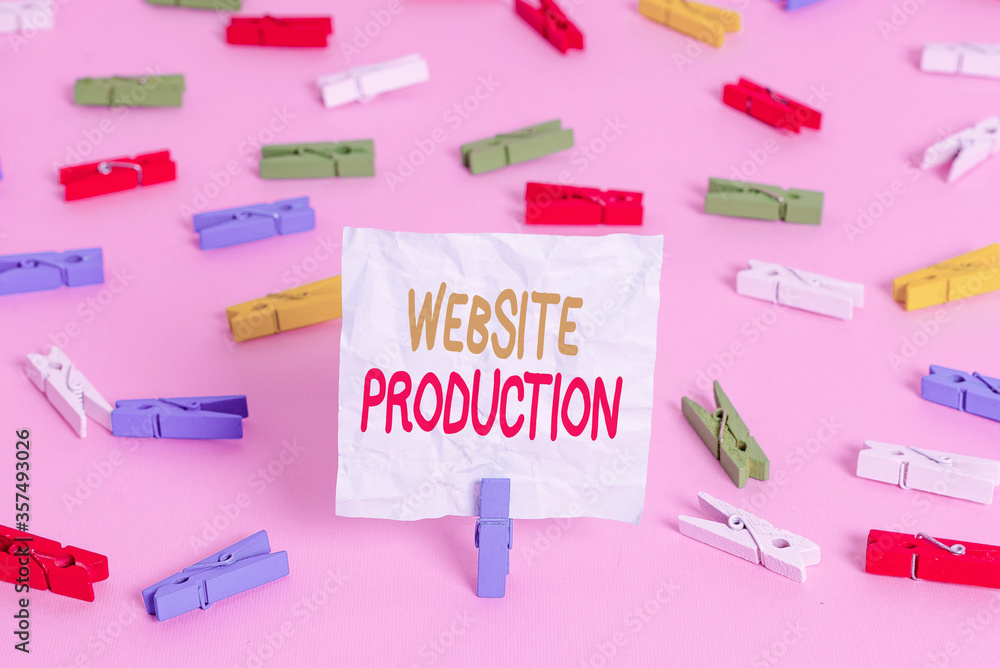 Fototapete Writing note showing Website Production. Business concept for creating sites with layout content and graphic design Colored clothespin papers empty reminder pink floor office pin