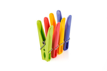 Color plastic clothespins isolated on white background. Plastic clips. Close-up. Full depth of field.