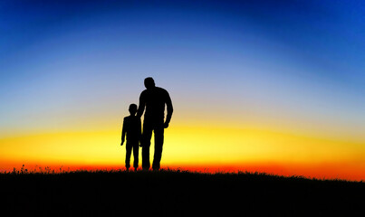 Fototapeta premium father and son at sunset. Happy concept of parenting and taking care of children.