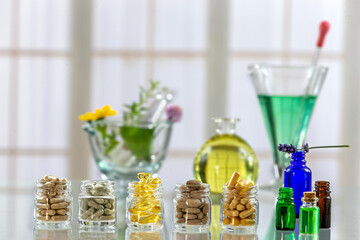 herbal medicine , food supllement capsules, capsules, green, herbal, , medicine, mortar, natural,product portar and medicine flower on background