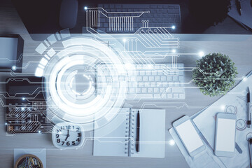 Multi exposure of data drawing hologram over topview of study desk background with computer. Concept of technology.
