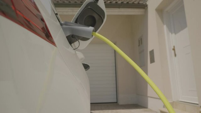 Shot of an environmentally-friendly electric car being charged