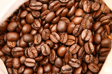 Brown tasty roasted coffee beans background