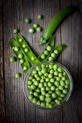 organic green peas on a wooden table