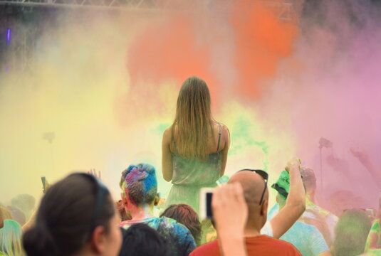 Cracow, Poland - June 10, 2018. People dancing and celebrating during Music and Holi Colors festival.