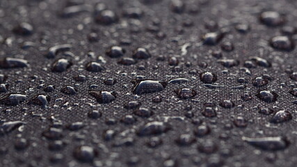 Morning dew water droplets on a waterproof material barbecue cover