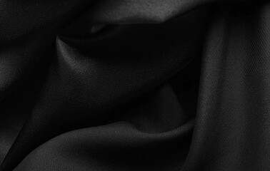 Smooth elegant black satin background.