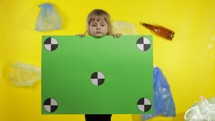 Girl activist holding chroma key poster with tracking points. Environment trash plastic pollution