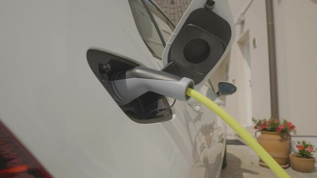 CU shot of an green-friendly electric car charging