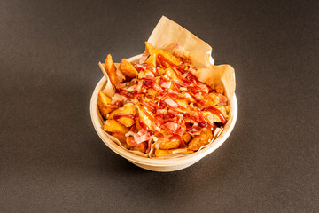 Potato bowl with sauces and bacon